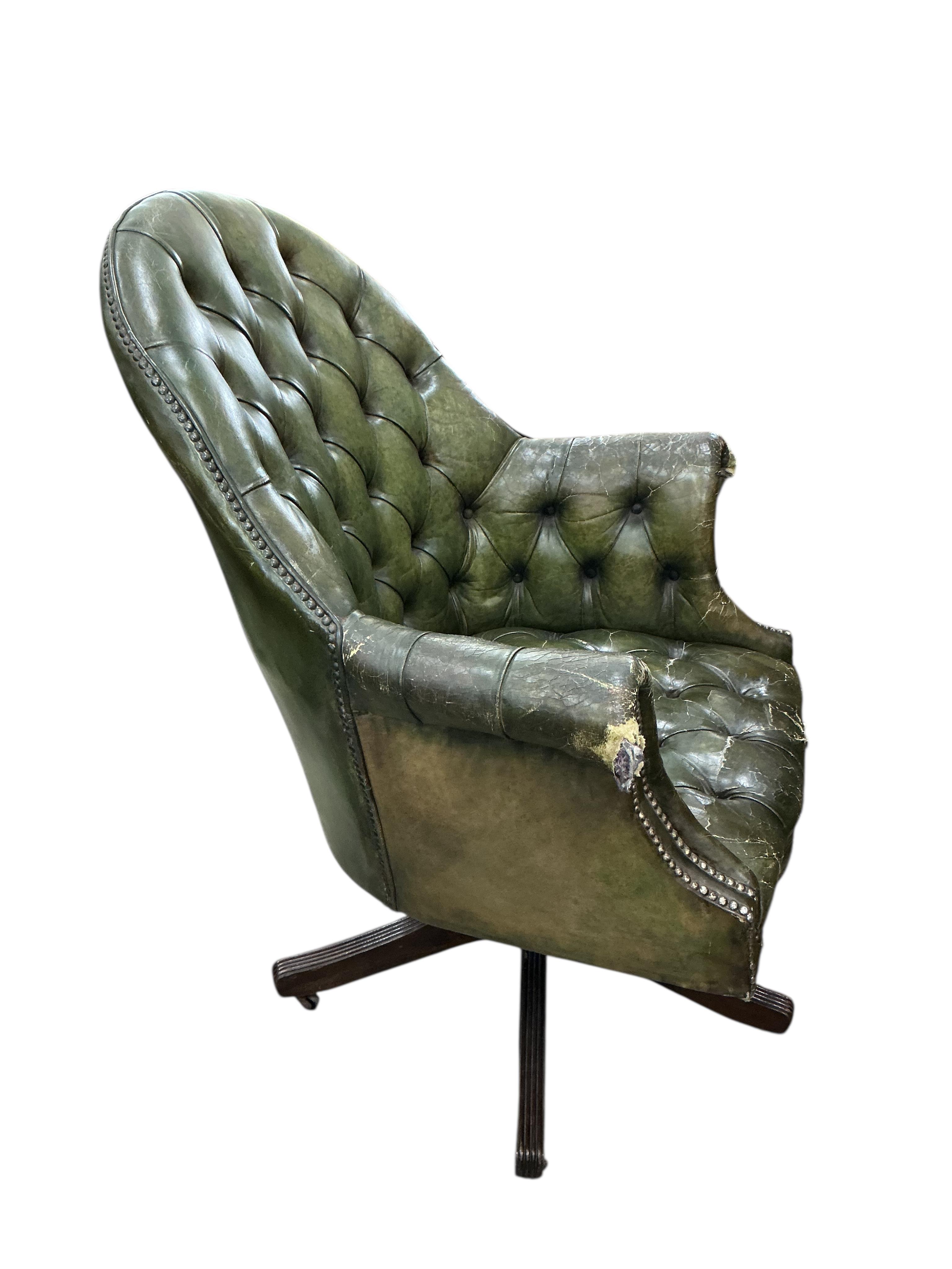 A reproduction George III style mahogany pedestal partners desk, width 180cm, depth 120cm, height 76cm, together with a button green leather swivel desk chair